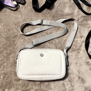 LULULEMON CAMERA CROSSBODY BAG. Raw linen. Good condition.